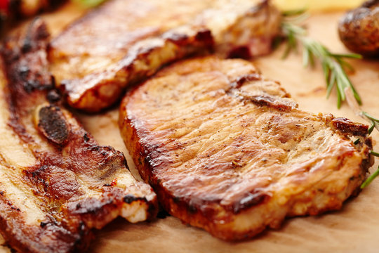 Fried pork meat on a wooden board