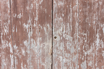 old wooden and grungy locked door