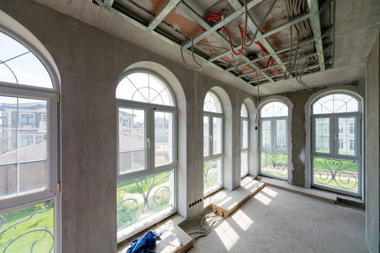 Interior house under construction with large windows