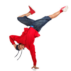 Hip Hop dancer doing one hand stand