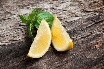Lemon. Fruit pieces on wooden table. Organic food