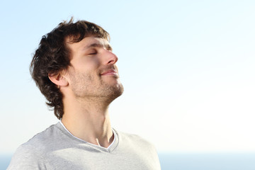 Close up of a man doing breath exercises outdoor - obrazy, fototapety, plakaty