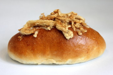 Bun with sweet dried pork on top