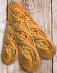 Bread baguettes on rustic wood