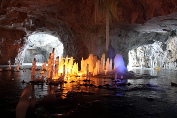 Stalagmite in deep marble cave, Russia