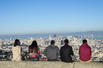 People looking at San Francisco skyline from Twin Peaks