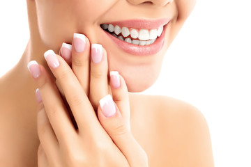 Obraz na płótnie Canvas Face, hands and healthy white teeth of a woman