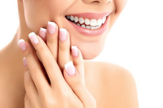 Face, hands and healthy white teeth of a woman