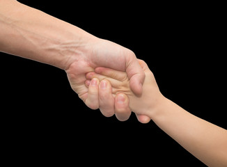 hands of father and son on a black background