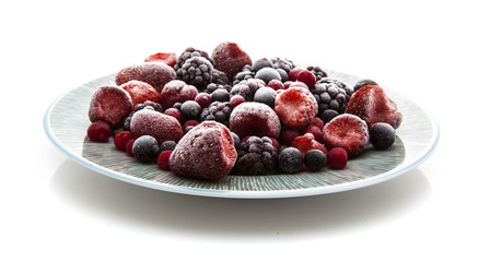 Plate of frozen fruit on a white background