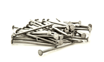 Pile of nails on white background