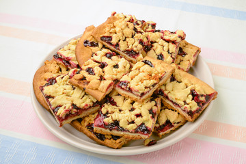 Closeup on pieces of blackberry jam grated pie	