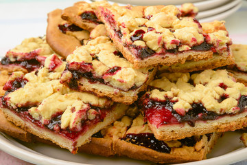 Closeup on pieces of blackberry jam grated pie