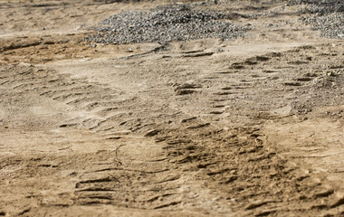 traces of the car wheels on the ground