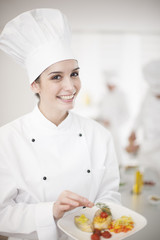 female chef presenting a dish