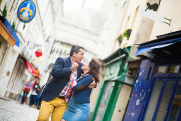 Couple dancing on a street of Montmartre