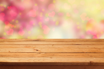 Dreamy background with empty table and heart shape bokeh