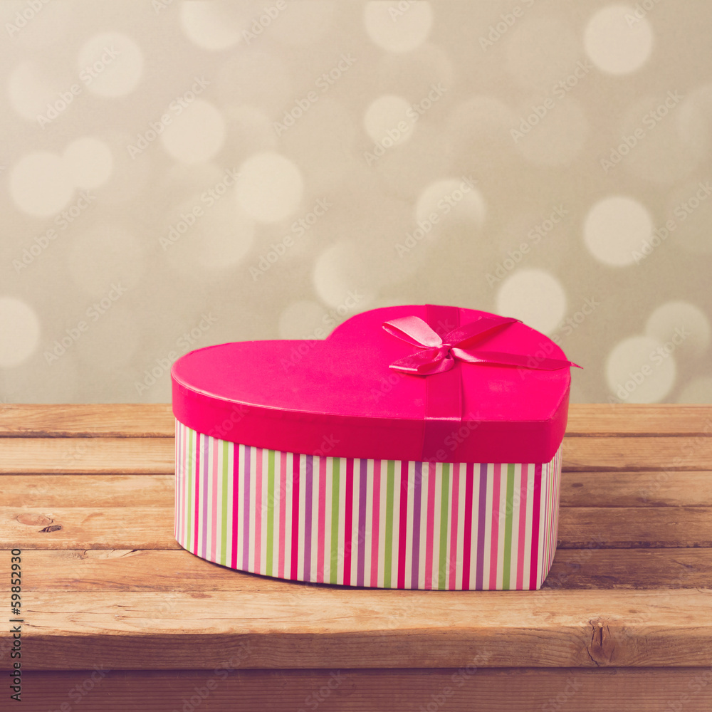 Wall mural valentine's day gift box over bokeh background