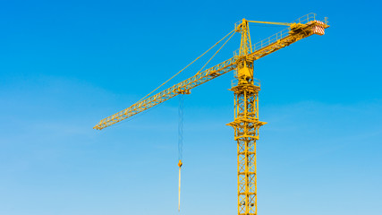 hoisting crane and blue sky