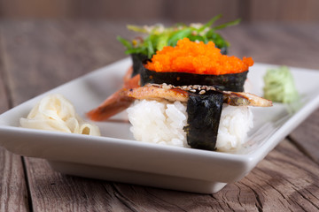 fresh sushi on wooden background