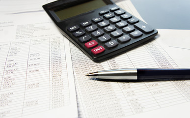 Naklejka na ściany i meble Office table with calculator, pen and accounting document
