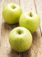green apple on wooden background