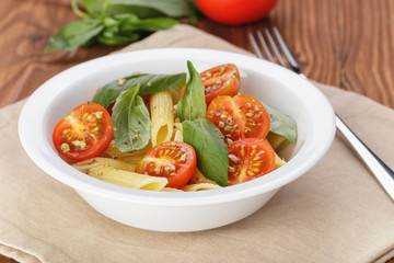 simple italian pasta penne with tomatoes and basil