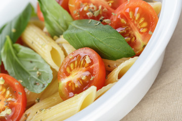 simple italian pasta penne with tomatoes and basil