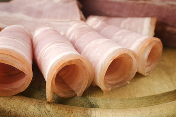 Fresh ham slices on the wooden board