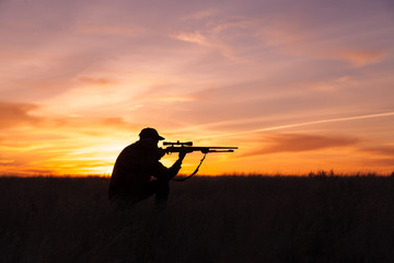 Hunter Shooting at Sunset