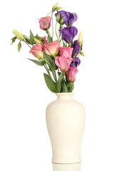 Bouquet of eustoma flowers in vase isolated on white