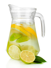 Cold water with lime, lemon and ice in pitcher isolated on