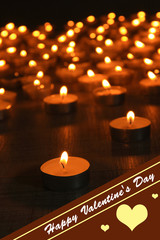 Burning candles on dark background
