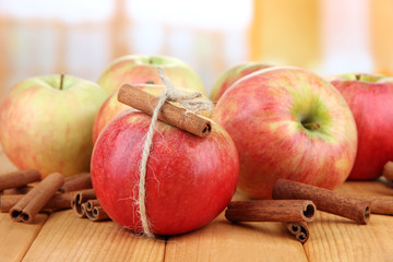 Ripe apples with with cinnamon sticks