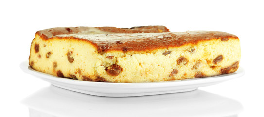 Cheese casserole with raisins on plate isolated on white