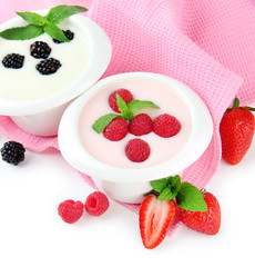 Delicious yogurt with berries isolated on white