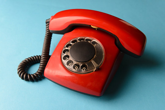 Red retro telephone,on color background