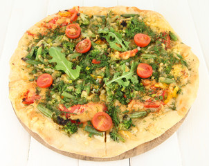 Tasty vegetarian pizza on wooden table