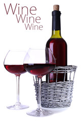 Wineglasses with red wine, and bottle isolated on white
