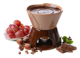 Chocolate fondue with marshmallow candies and fruits, isolated