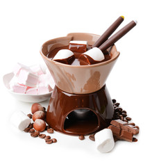 Chocolate fondue with marshmallow candies, isolated on white