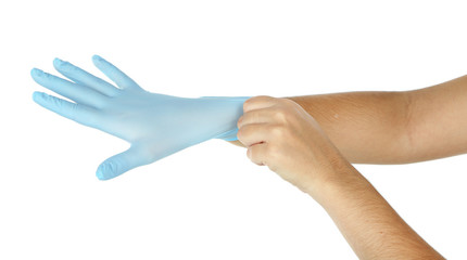 Doctor putting on protective gloves, isolated on white