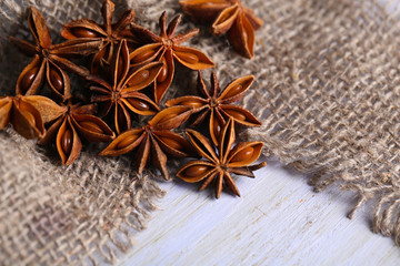 Star anise on wooden background
