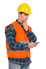 Engineer reading message at smart phone.