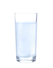 Glass with efervescent tablet in water with bubbles isolated