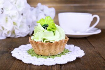 Tasty cake on table on wooden background