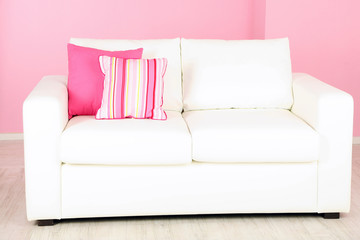 White sofa in room on pink background