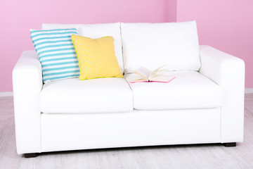 White sofa in room on pink background