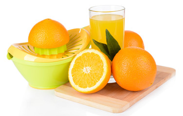 Citrus press and oranges isolated on white