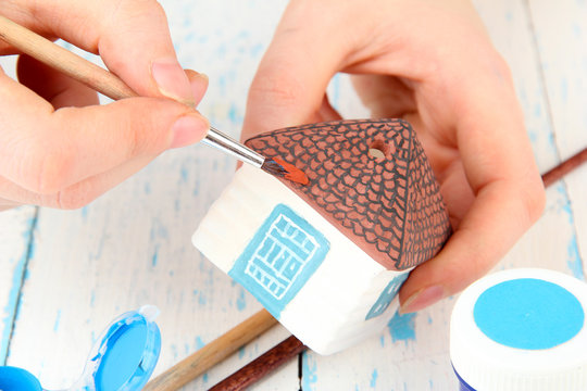 Hands Paints On Hand Made Ceramic House And  Art Materials